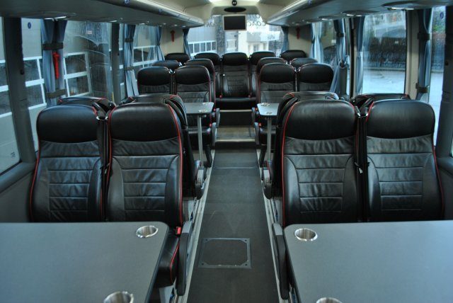 Full-size coach carrying a large group on a long-distance trip