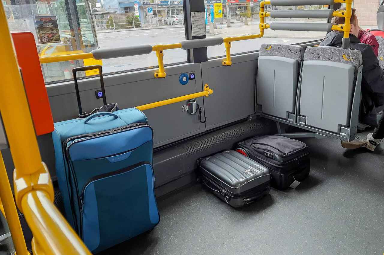 Undercarriage luggage hold of a full-size charter coach loaded with bags